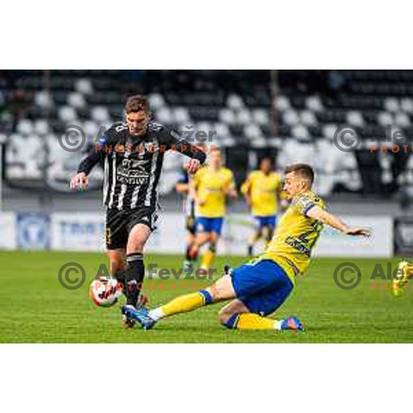 Nardin Mulahusejnovic and Zan Zuzek in action during Prva Liga Telemach 2021-2022 football match between Mura and Koper in Murska Sobota, Slovenia on April 3, 2022