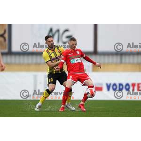 Mateo Muzek and Dino Spehar in action during Prva Liga Telemach 2021-2022 football match between Kalcer Radomlje and Aluminij in Domzale, Slovenia on April 9, 2022