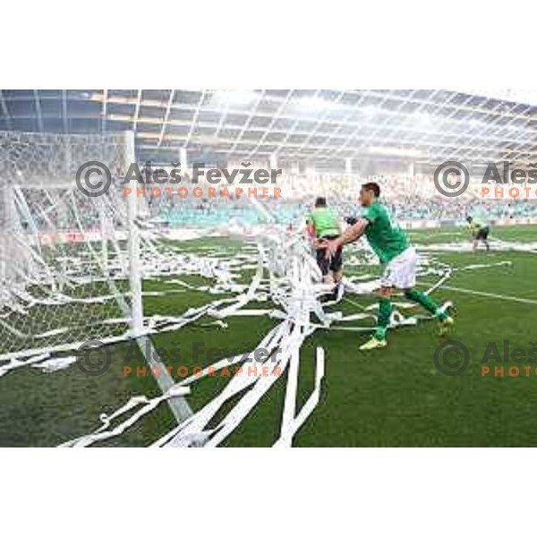 Ivan Prtajin collects paper stripes on the pitch during Prva Liga Telemach football match between Olimpija and Mura in SRC Stozice, Ljubljana, Slovenia on May 15, 2022
