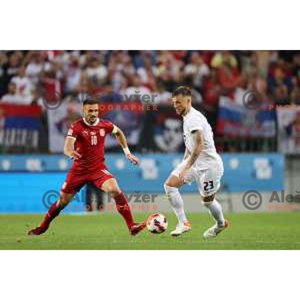 Dusan TAdic and David Brekalo in action during UEFA Nations league football match between Slovenia and Serbia in SRC Stozice, Ljubljana, Slovenia on June 12, 2022