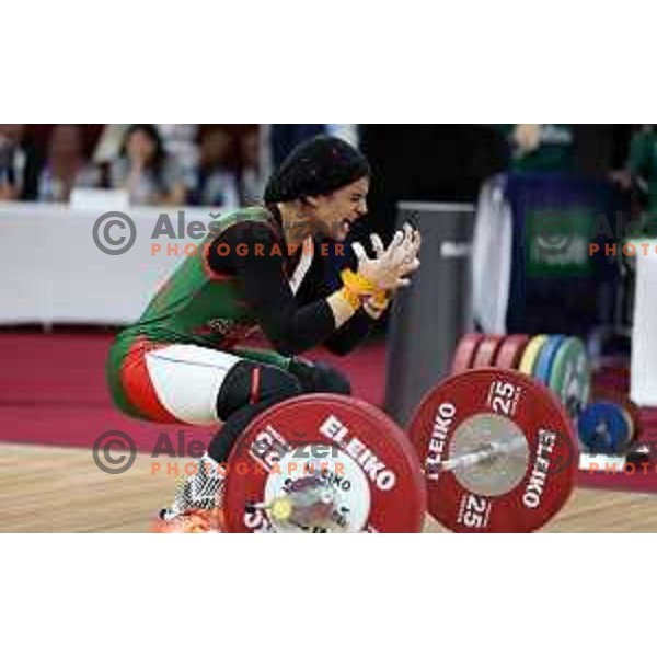 Fatima Laghouati (ALG) competes in snatch in Women’s -59 kg category in Weightlifting at Mediterranean Games in Oran, Algeria on July 2, 2022