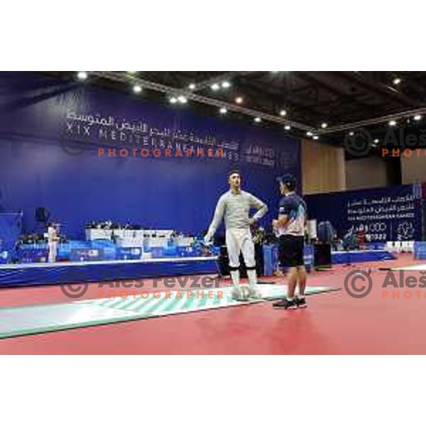 Peter Krajnc (SLO) and coach Roberto de Nicola at Men’s Sabre Individual at Mediterranean Games in Oran, Algeria on July 3, 2022 