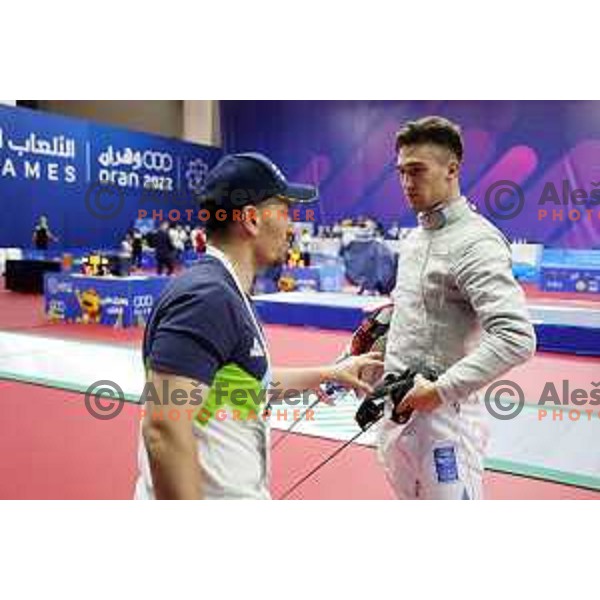 Peter Krajnc (SLO) and coach Roberto de Nicola at Men’s Sabre Individual at Mediterranean Games in Oran, Algeria on July 3, 2022 