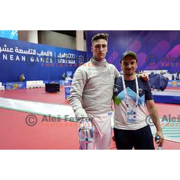 Peter Krajnc (SLO) and coach Roberto de Nicola at Men’s Sabre Individual at Mediterranean Games in Oran, Algeria on July 3, 2022 
