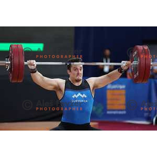Jure Skedelj (SLO) competes in snatch in Men’s 102 kg category in Weightlifting at Mediterranean Games in Oran, Algeria on July 4, 2022