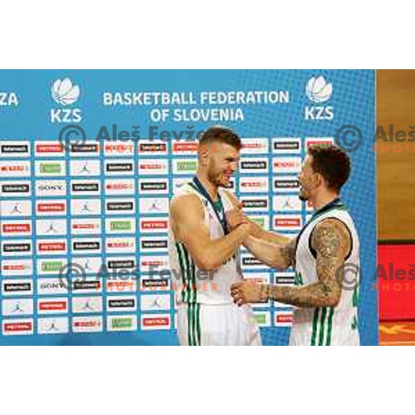 Edo Muric and Josh Adams celebrate victory in the Slovenian basketball SuperCup match between Cedevita Olimpija and Helios Suns in Skofja Loka on September 23, 2022