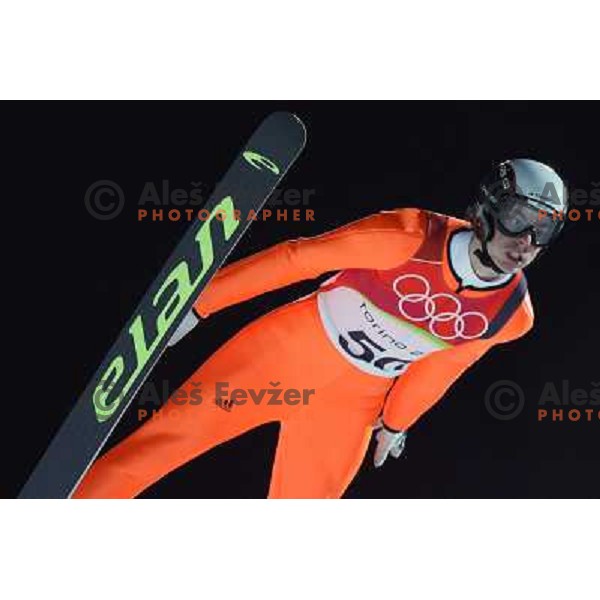 Rok Benkovic of Slovenia jumping in qualification round at 90 m individual ski jumping event in Pragelato at Torino 2006 winter Olympic games, Italy on February 11, 2006