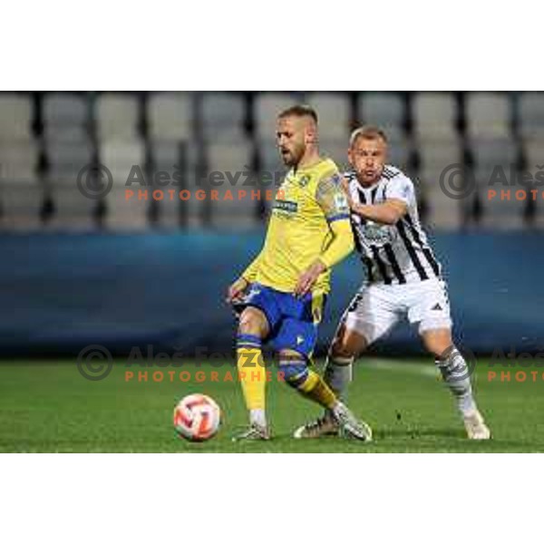 Domantas Simkus and Andrej Kotnik in action during Prva Liga Telemach 2022-2023 football match between Koper and Mura at Bonifika Arena in Koper, Slovenia on November 30, 2022