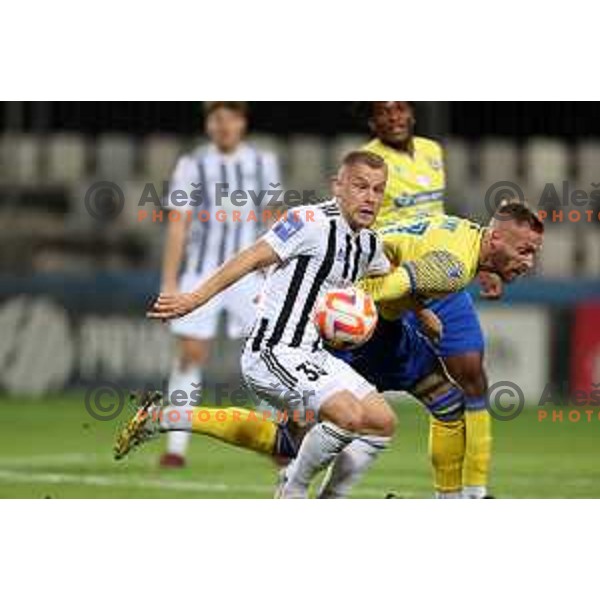 Domantas Simkus and Andrej Kotnik in action during Prva Liga Telemach 2022-2023 football match between Koper and Mura at Bonifika Arena in Koper, Slovenia on November 30, 2022