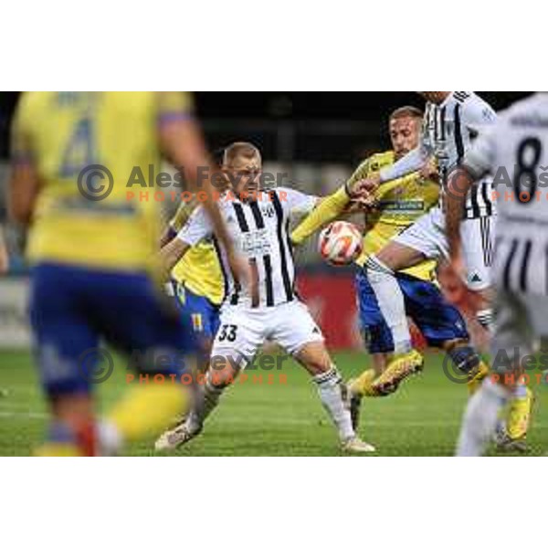 Domantas Simkus and Andrej Kotnik in action during Prva Liga Telemach 2022-2023 football match between Koper and Mura at Bonifika Arena in Koper, Slovenia on November 30, 2022