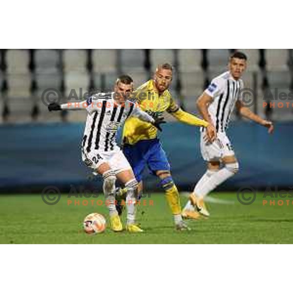 Tio Cipot and Andrej Kotnik in action during Prva Liga Telemach 2022-2023 football match between Koper and Mura at Bonifika Arena in Koper, Slovenia on November 30, 2022