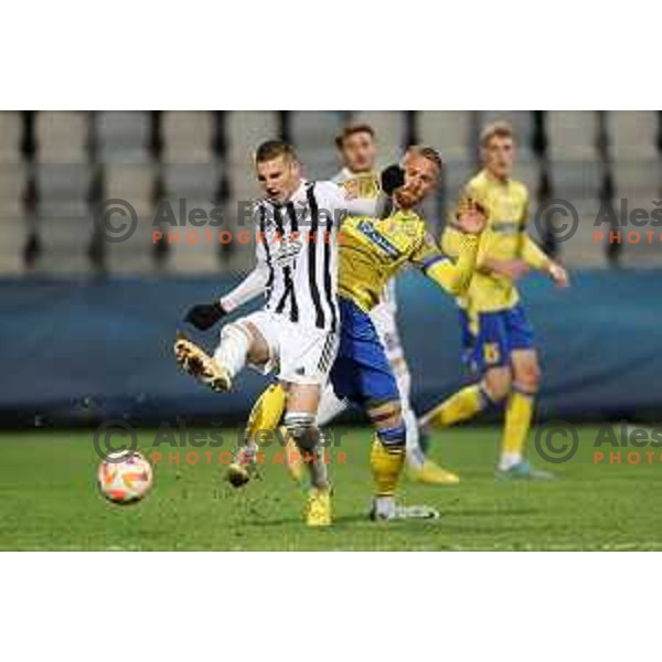 Tio Cipot and Andrej Kotnik in action during Prva Liga Telemach 2022-2023 football match between Koper and Mura at Bonifika Arena in Koper, Slovenia on November 30, 2022