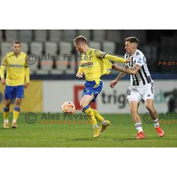 Rudi Pozeg Vancas and Martin Sroler in action during Prva Liga Telemach 2022-2023 football match between Koper and Mura at Bonifika Arena in Koper, Slovenia on November 30, 2022