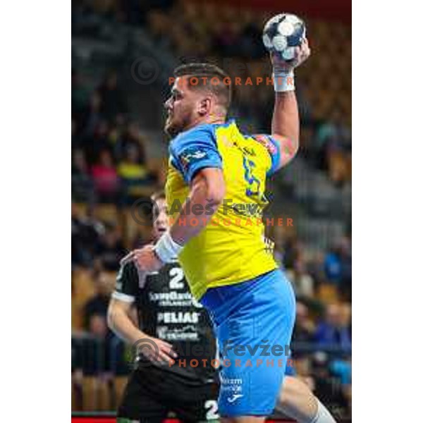 Matic Suholeznik in action during EHF Champions League handball match between Celje Pivovarna Lasko and Elverum handball in Zlatorog Arena, Celje, Slovenia on December 7, 2022