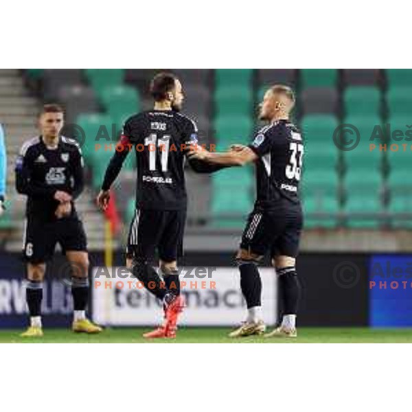 Ziga Kous and Domantas Simkus in action during Prva Liga Telemach 2022-2023 football match between Olimpija and Mura in SRC Stozice, Ljubljana, Slovenia on December 8, 2022