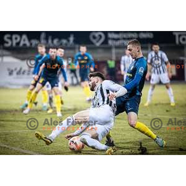 Dardan Shabanhaxhaj vs Zan Karnicnik in action during Prva liga Telemach football match between Celje and Mura in Arena z’dezele, Celje, Slovenia on February 11, 2023. Photo: Jure Banfi