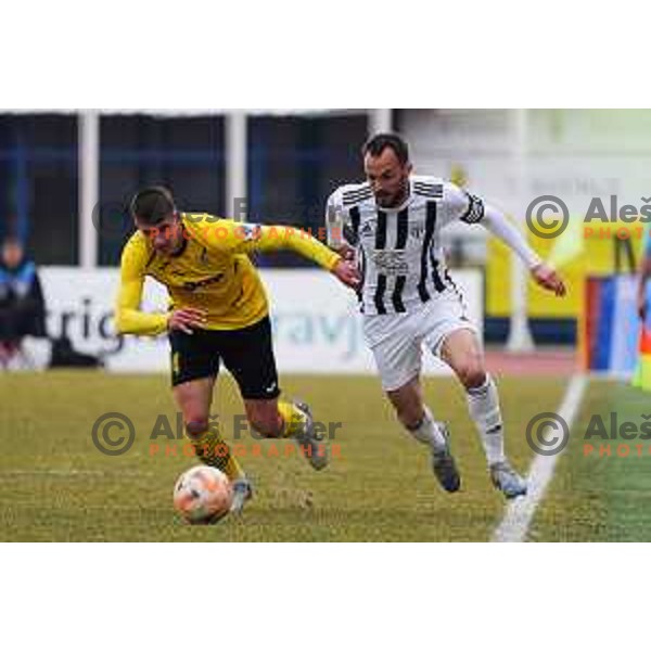 Tin Hrvoj of Kalcer Radomlje and Ziga Kous of Mura during Prva Liga Telemach 2022-2023 football match between Kalcer Radomlje and Mura in Sportni park Domzale, Domzale, Slovenia on February 18, 2023