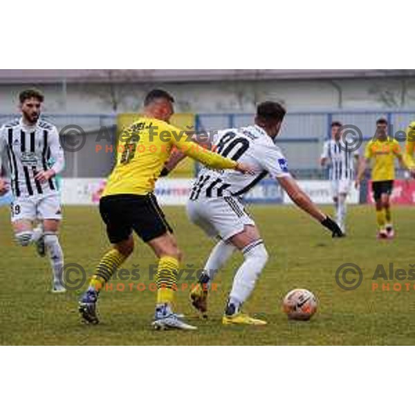 Vicko Sevelj of Kalcer Radomlje and Nikola Petkovic of Mura during Prva Liga Telemach 2022-2023 football match between Kalcer Radomlje and Mura in Sportni park Domzale, Domzale, Slovenia on February 18, 2023