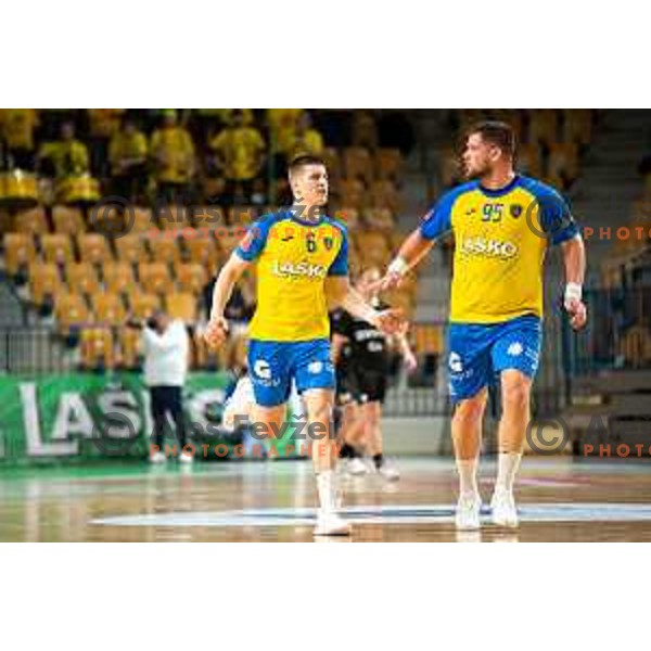 Tadej Mazej and Matic Suholeznik in action during 1.NLB league handball match between Celje Pivovarna Lasko and Gorenje Velenje in Arena Zlatorog, Celje, Slovenia on February 26, 2023