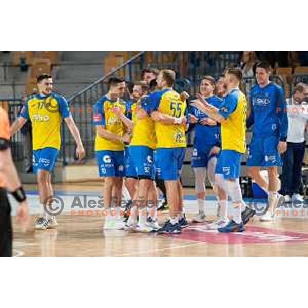 Ziga Malakar, Aleks Vlah and players of Celje celebrate victory at 1.NLB league handball match between Celje Pivovarna Lasko and Gorenje Velenje in Arena Zlatorog, Celje, Slovenia on February 26, 2023
