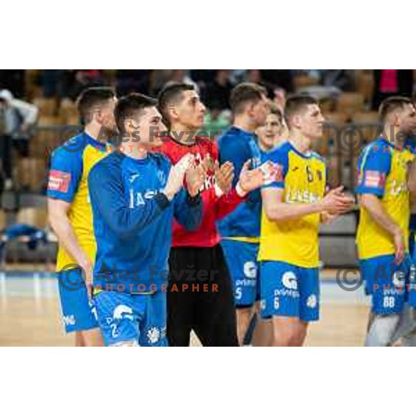 Tilen Strmljan and players of Celje celebrate victory at 1.NLB league handball match between Celje Pivovarna Lasko and Gorenje Velenje in Arena Zlatorog, Celje, Slovenia on February 26, 2023