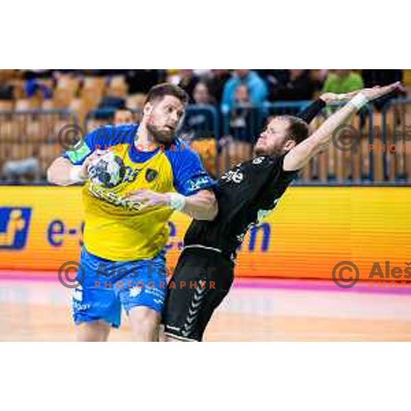 Matic Suholeznik in action during Slovenian cup handball match between Celje Pivovarna Lasko and Gorenje Velenje in Arena Zlatorog, Celje, Slovenia on March 15, 2023