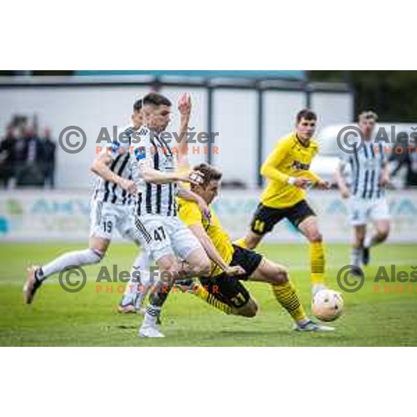 Mihael Klepac vs Gaber Dobrovoljc in action during Prva liga Telemach football match between Mura and Radomlje in Fazanerija, Murska Sobota, Slovenia on April 15, 2023. Photo: Jure Banfi