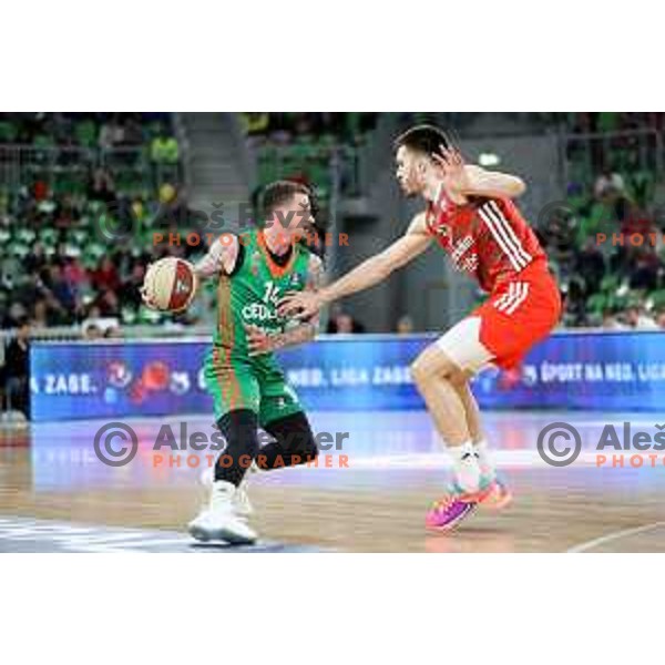 Josh Adams of Cedevita Olimpija and Filip Petrusev of Crvena Zvezda mts during ABA League 2022-2023 match between Cedevita Olimpija and Crvena Zvezda mts (SRB) in Ljubljana, Slovenia on April 24, 2023. Foto: Filip Barbalic