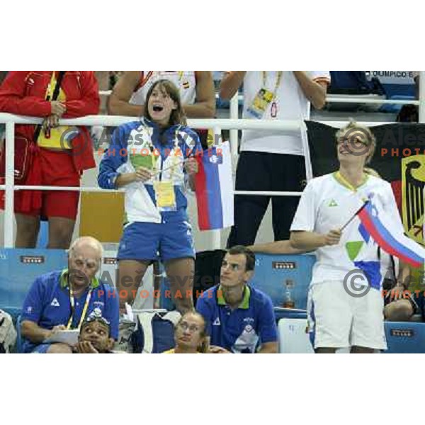 Sara Isakovic, Luka Turk, Vlado Cermak celebrate entry od Damir Dugonjic (SLO) in semi-finals at 100 meters breaststroke in swiming competition at Olympic Games in Beijing, China 9.8.2008. Photo by Ales Fevzer 