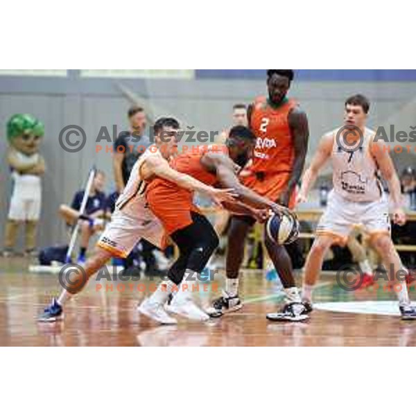 Rok Nemanic and Sean Armand in action during Slovenian SuperCup basketball match between Cedevita Olimpija and Kansai Helios Domzale in Kranj, Slovenia on September 25, 2023