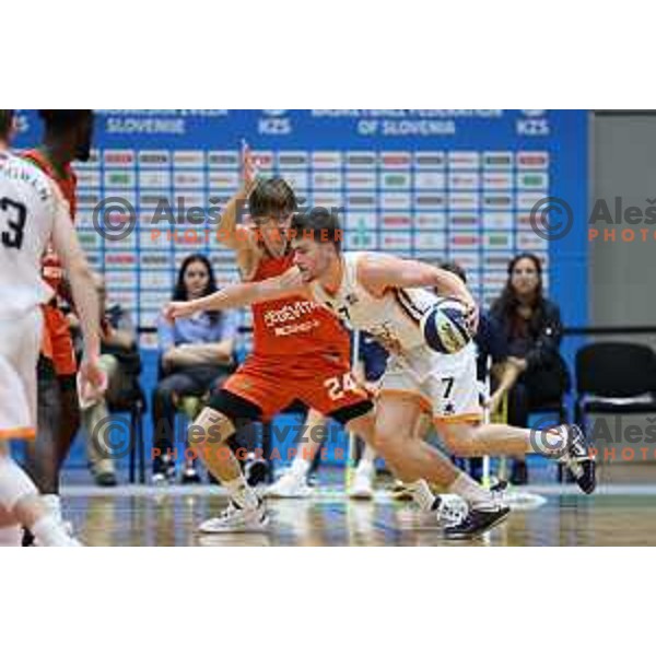 Jaka Klobucar and Tibor Mirtic in action during Slovenian SuperCup basketball match between Cedevita Olimpija and Kansai Helios Domzale in Kranj, Slovenia on September 25, 2023