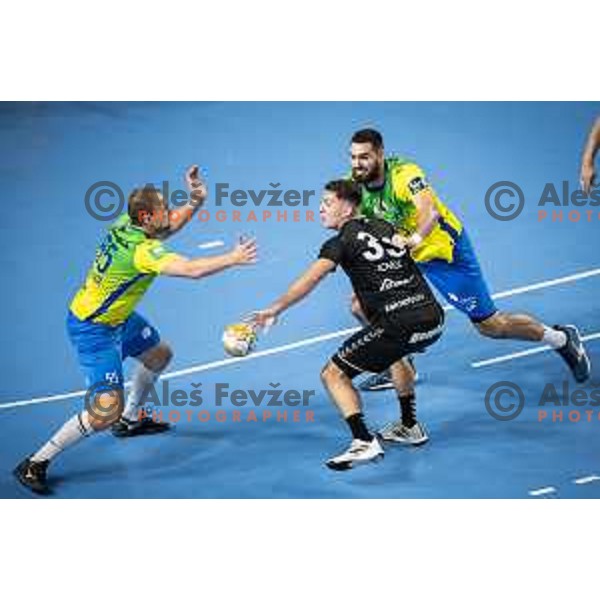 Enej Slatinek Jovicic vs Stefan Zabic in action during 1.NLB league handball match between Celje Pivovarna Lasko and Gorenje Velenje in Dvorana Zlatorog, Celje, Slovenia on October 14, 2023. Photo: Jure Banfi