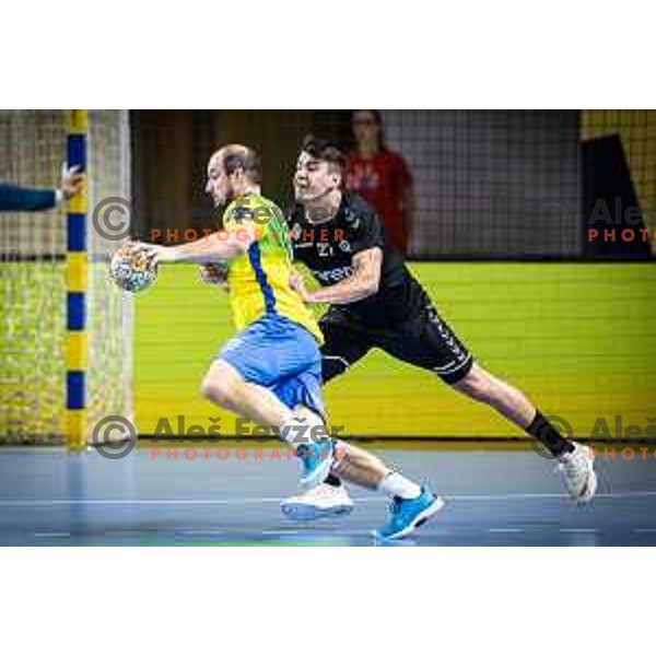 Grega Krecic vs Peter Sisko in action during 1.NLB league handball match between Celje Pivovarna Lasko and Gorenje Velenje in Dvorana Zlatorog, Celje, Slovenia on October 14, 2023. Photo: Jure Banfi