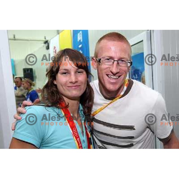 Sara Isakovic receives congratulations from Matic Osovnikar and slovenian athletes at press conference in Olympic Village 13.8.2008 