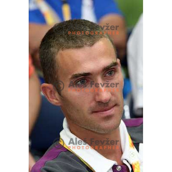Damjan Zlatnar watches Sara Isakovic receives congratulations from slovenian athletes at press conference in Olympic Village 13.8.2008 