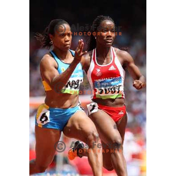 Chandra Sturrup (BAH,1092) and Semoy Hackett (TRI,3015) in qualification of 100 meters at Olympic games in Beijing, China 16.8.2008 