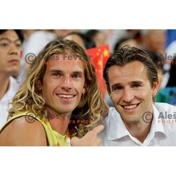 Jure Rovan and his manager Andre Thomson watching Marija Sestak (SLO) placed sixth in women\'s triple jump at the Olympic games in Beijing, China 17.8.2008 