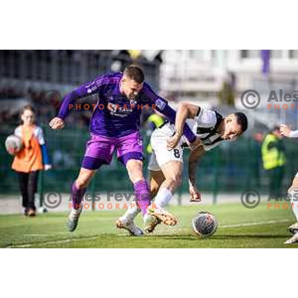 Pijus Sirvys vs Thalisson Charles Alves Moreira in action during Prva liga Telemach football match between Rogaska and Maribor in Sportni center Rogaska Slatina, Slovenia on February 25, 2024. Photo: Jure Banfi