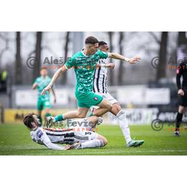 Klemen Pucko vs Raul Alexander Florucz in action during Prva liga Telemach football match between Mura and Olimpija in Fazanerija, Murska Sobota, Slovenia on March 10, 2024. Photo: Jure Banfi