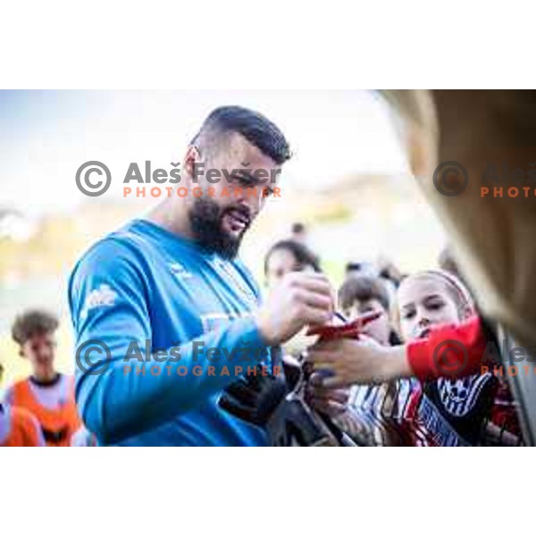 Ajdin Mulalic signing autographs after Prva liga Telemach football match between Rogaska and Mura in Sportni center Rogaska Slatina, Slovenia on March 17, 2024. Photo: Jure Banfi