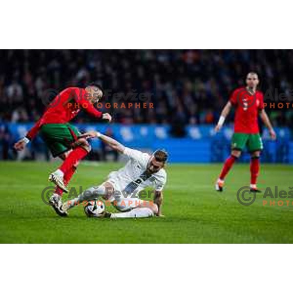 Cristiano Ronaldo of Portugal vs Sandi Lovric of Slovenia in action during Friendly football match between Slovenia and Portugal in Stadium Stozice, Slovenia on March 26, 2024. Photo: Grega Valancic