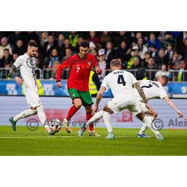 Petar Stojanovic of Slovenia vs Cristiano Ronaldo of Portugal in action during Friendly football match between Slovenia and Portugal in Stadium Stozice, Slovenia on March 26, 2024. Photo: Grega Valancic