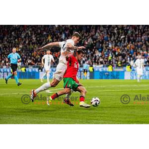 Jaka Bijol of Slovenia Otavio of Portugal in action during Friendly football match between Slovenia and Portugal in Stadium Stozice, Slovenia on March 26, 2024. Photo: Grega Valancic