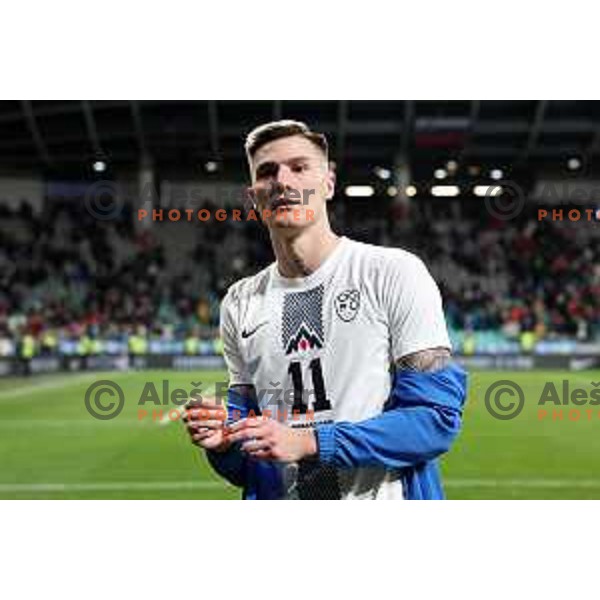 Benjamin Sesko gives his jersey to a young fan after friendly football match between Slovenia and Portugal in Ljubljana, Slovenia on March 26, 2024