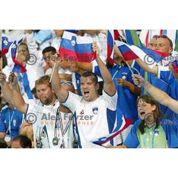 Peter Mankoc, Sara Isakovic and swimmers of Slovenia cheering at Athens 2004 Summer Olympic games in Athens, Greece on August 18, 2004