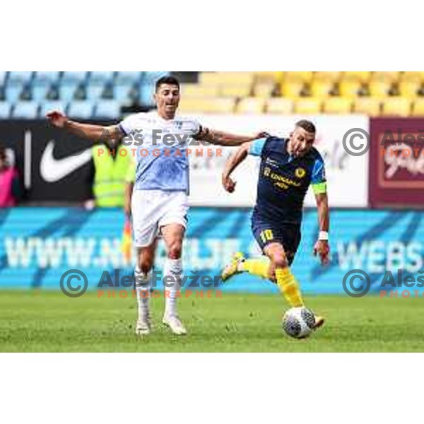 Zoran Lesjak and Nino Kouter in action during Prva Liga Telemach 2024/25 football match between Celje and Nafta 1903 in Celje, Slovenia on September 15, 2024