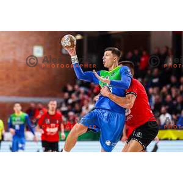 in action during 1.NLB League handball match between LL Grosist Slovan and Celje in Ljubljana, Slovenia on October 22, 2024