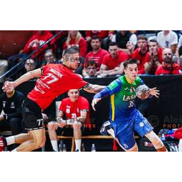 Andraz Makuc in action during 1.NLB League handball match between LL Grosist Slovan and Celje in Ljubljana, Slovenia on October 22, 2024