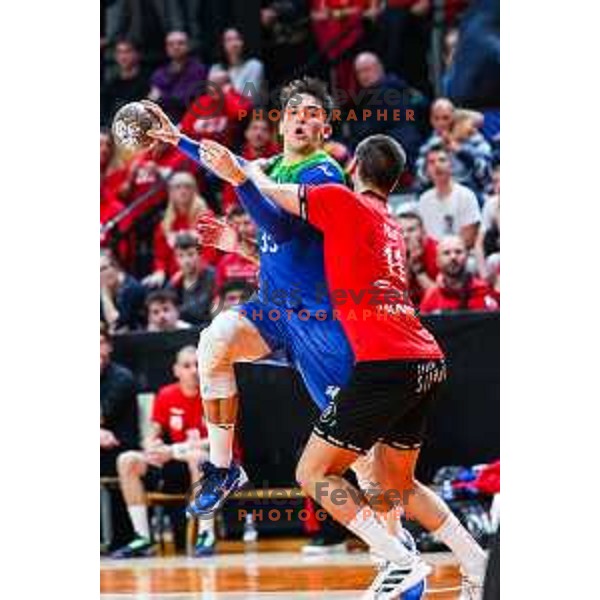 Andraz Makuc in action during 1.NLB League handball match between LL Grosist Slovan and Celje in Ljubljana, Slovenia on October 22, 2024