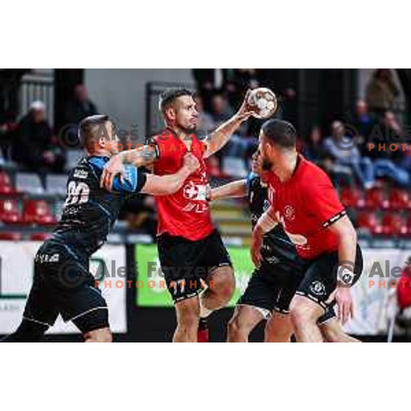 Gasper Hrastnik in action during 1.NLB League handball match between LL Grosist Slovan and Slovenj Gradec in Ljubljana, Slovenia on November 22, 2024